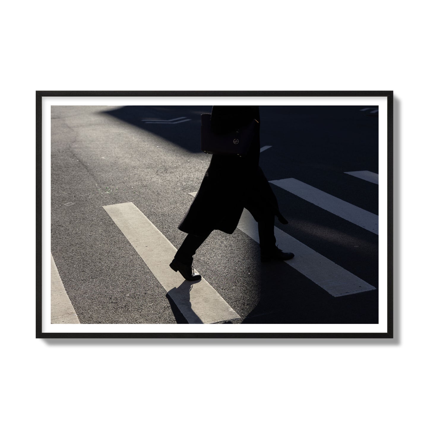 Fine art street photograph of a woman walking through a crosswalk in Soho New York, archival pigment print, gallery size, black frame