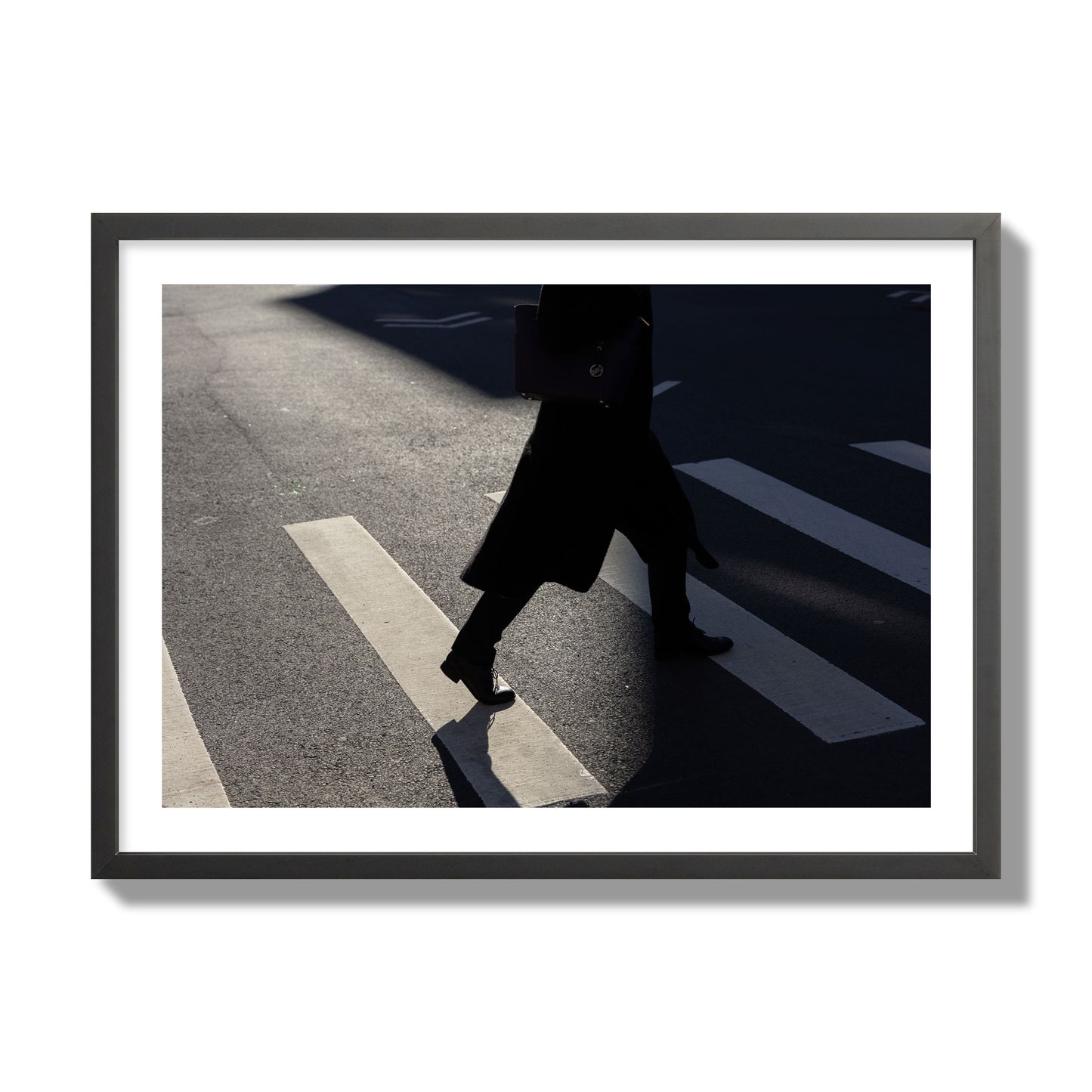 Fine art street photograph of a woman walking through a crosswalk in Soho New York, archival pigment print, giant size, black frame