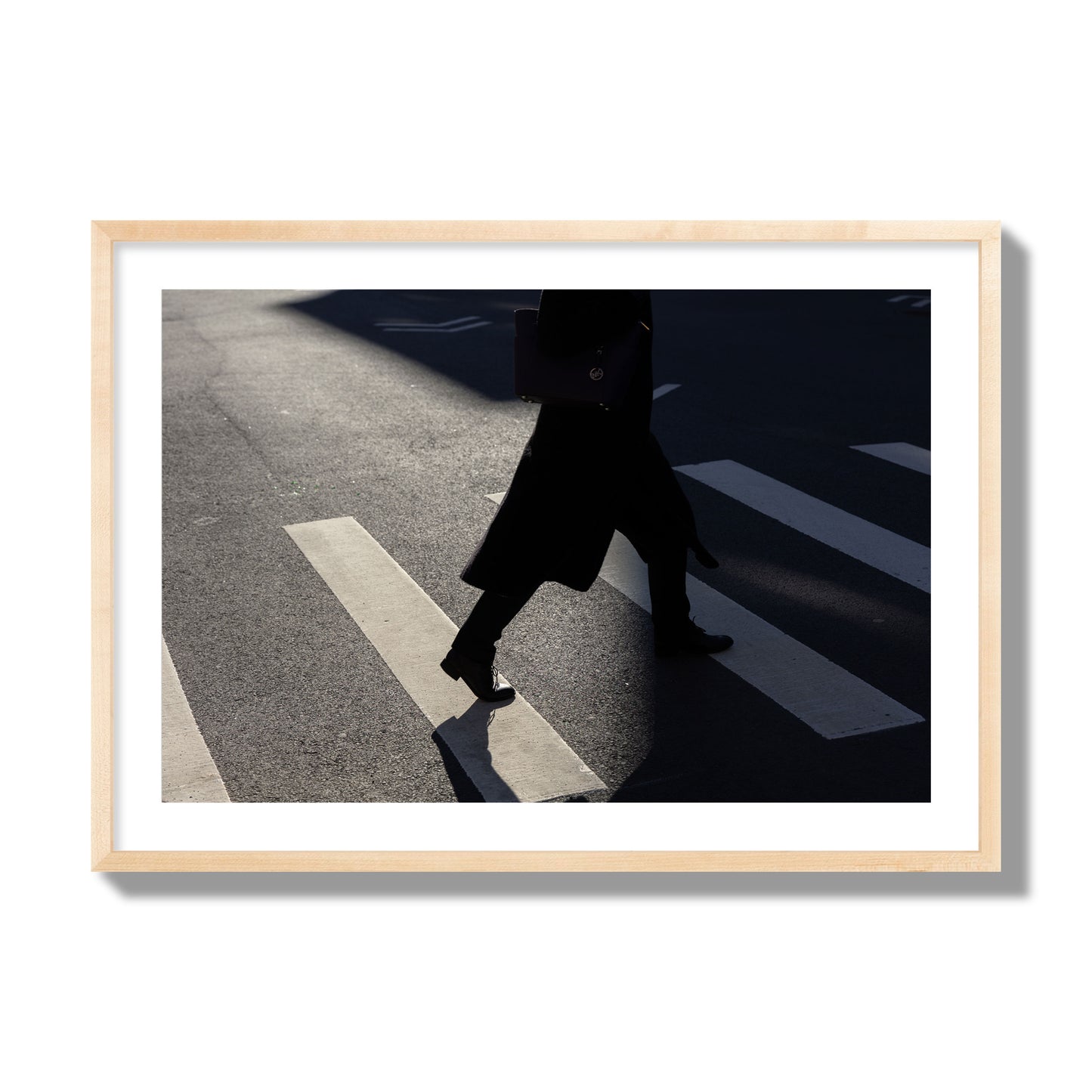Fine art street photograph of a woman walking through a crosswalk in Soho New York, archival pigment print, giant size, natural wood frame