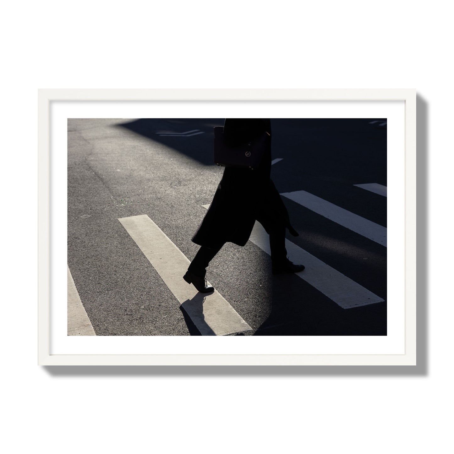 Fine art street photograph of a woman walking through a crosswalk in Soho New York, archival pigment print, giant size, white frame