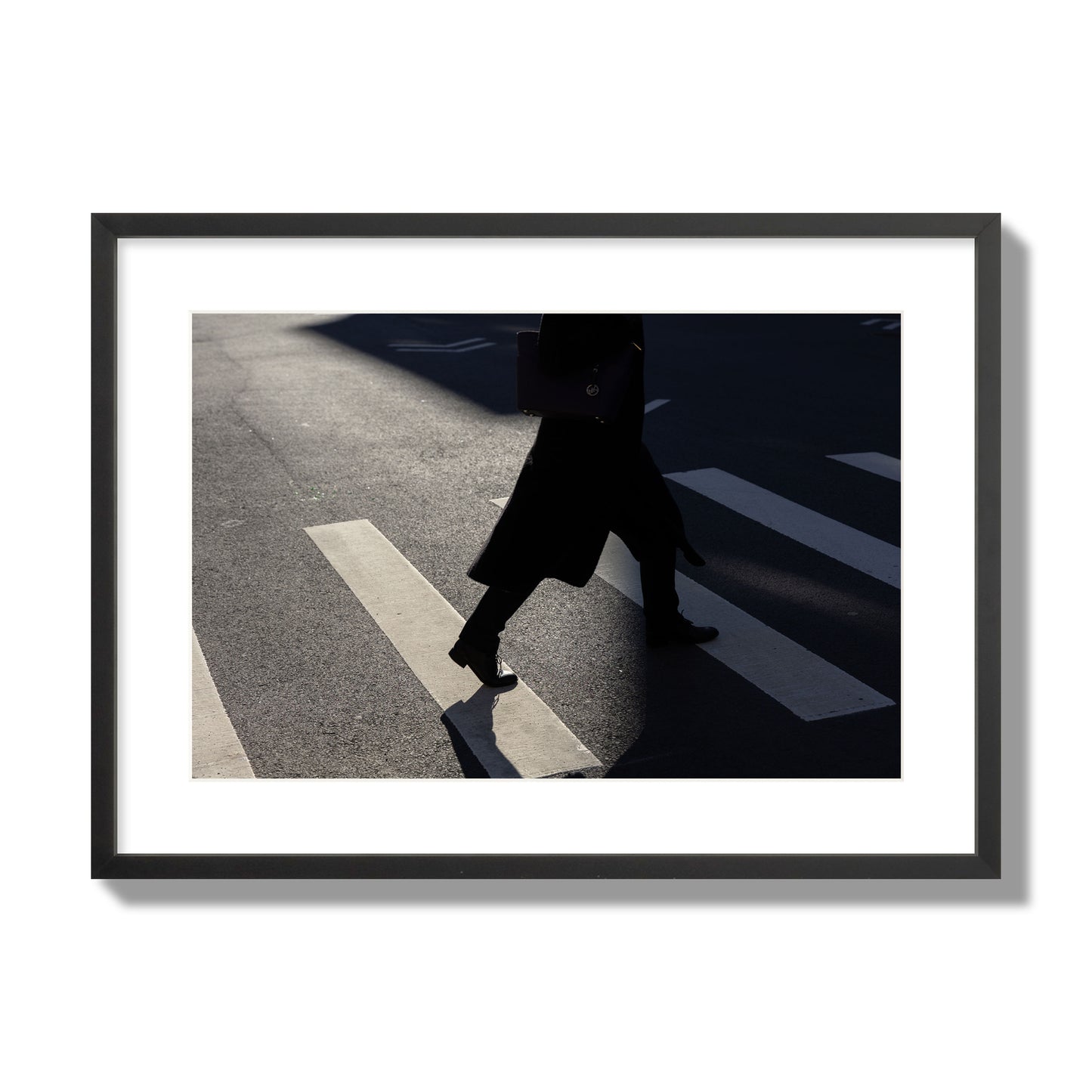 Fine art street photograph of a woman walking through a crosswalk in Soho New York, archival pigment print, large size, black frame