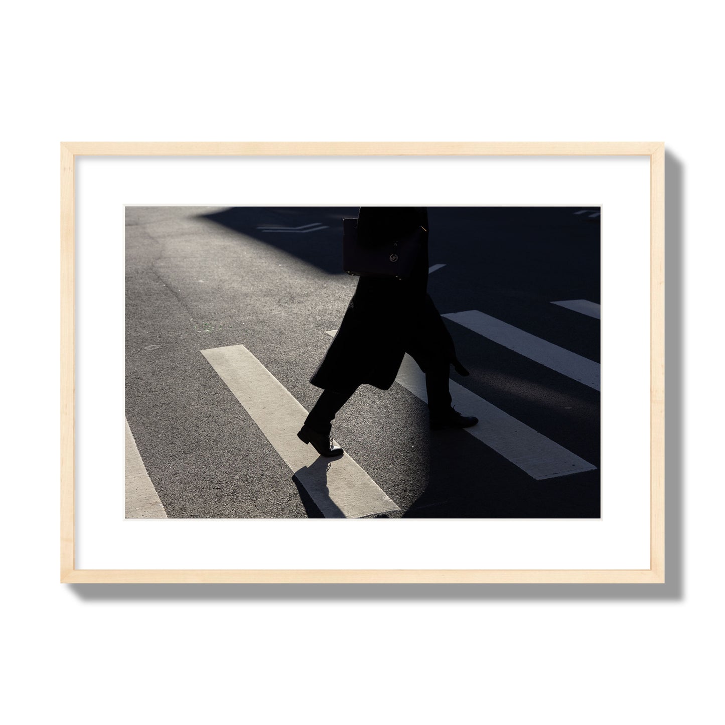 Fine art street photograph of a woman walking through a crosswalk in Soho New York, archival pigment print, large size, natural wood frame
