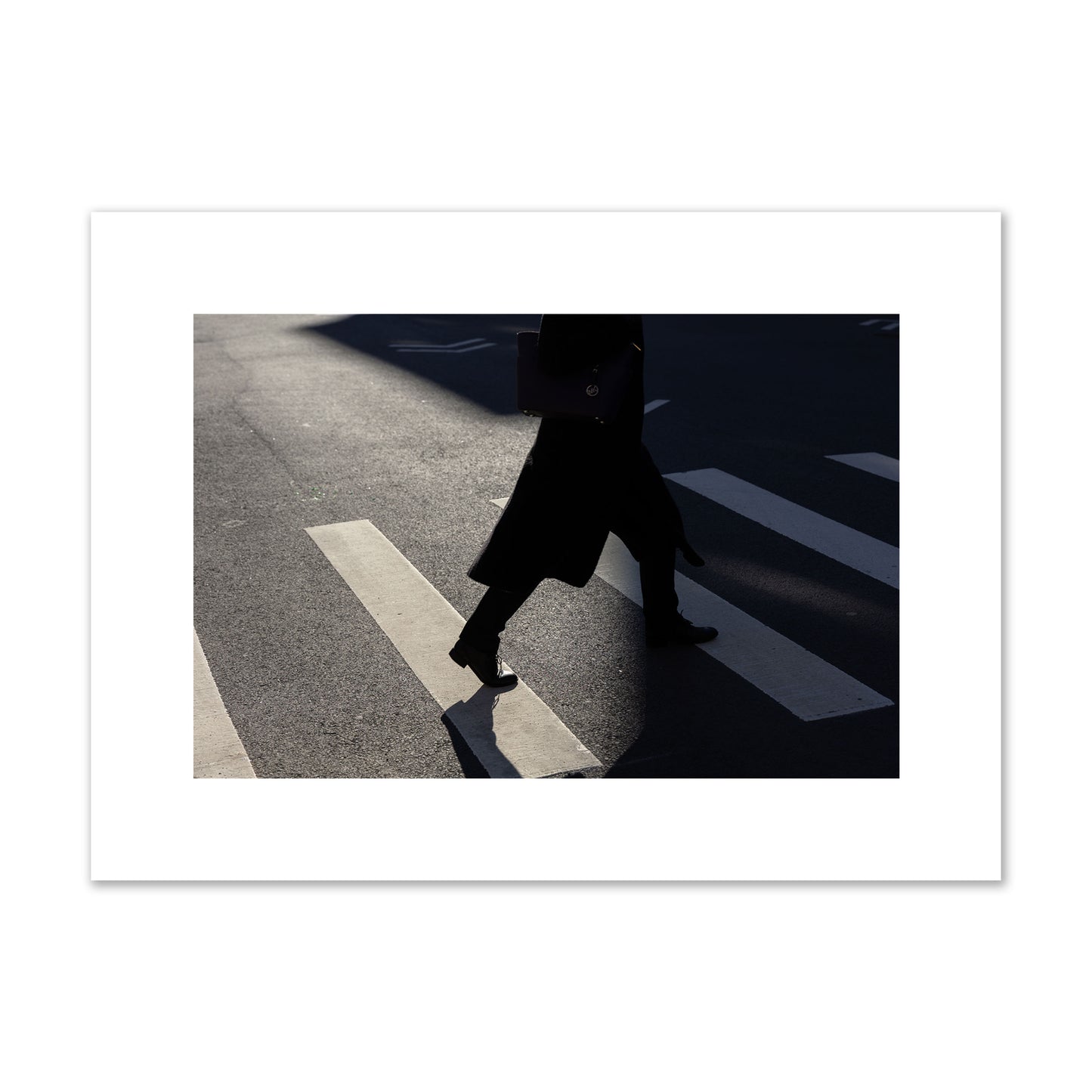 Fine art street photograph of a woman walking through a crosswalk in Soho New York, archival pigment print, medium size, unframed