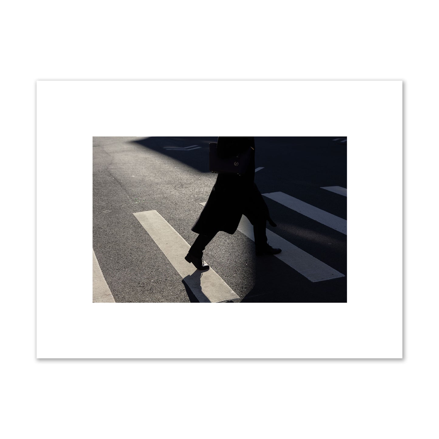 Fine art street photograph of a woman walking through a crosswalk in Soho New York, archival pigment print, small size, unframed