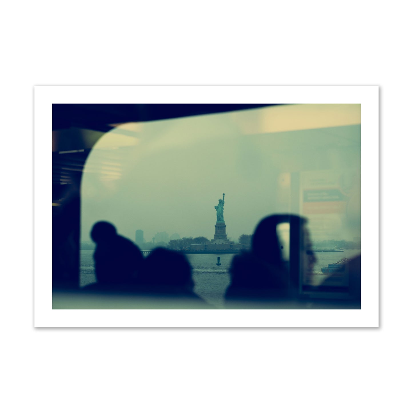 Fine art photograph of passengers silhouetted on a crowded ferry with the Statue of Liberty in the background, archival pigment print, collector size, unframed.