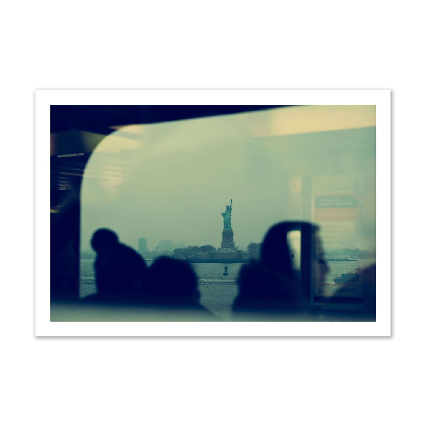 Fine art photograph of passengers silhouetted on a crowded ferry with the Statue of Liberty in the background, archival pigment print, gallery size, unframed.