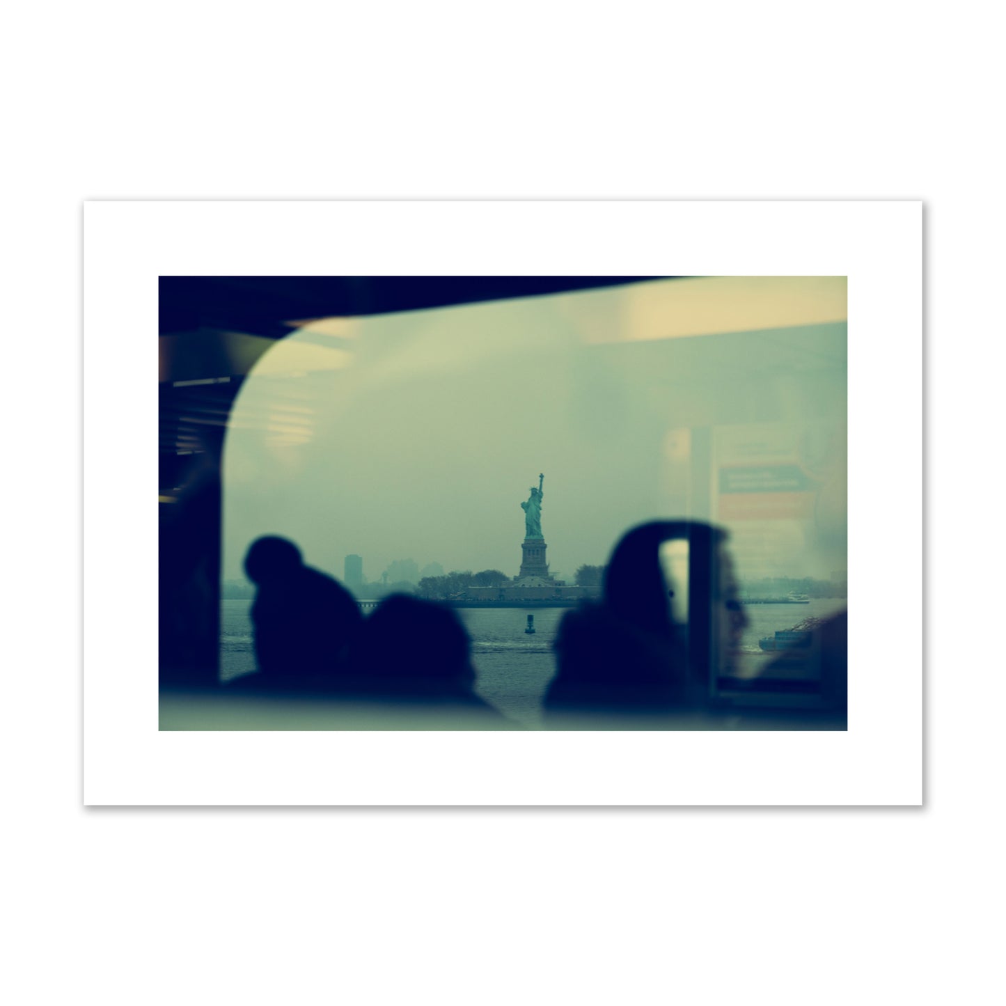 Fine art photograph of passengers silhouetted on a crowded ferry with the Statue of Liberty in the background, archival pigment print, large size, unframed.
