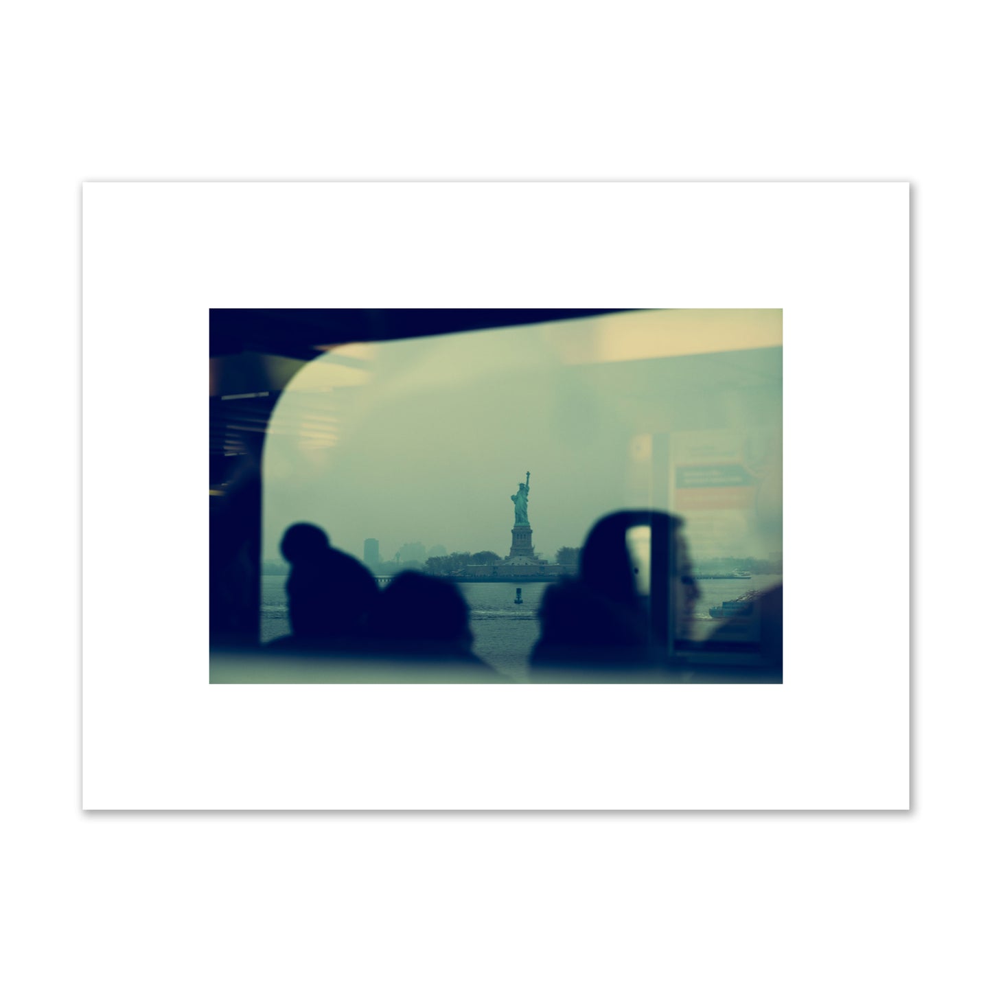 Fine art photograph of passengers silhouetted on a crowded ferry with the Statue of Liberty in the background, archival pigment print, small size, unframed.