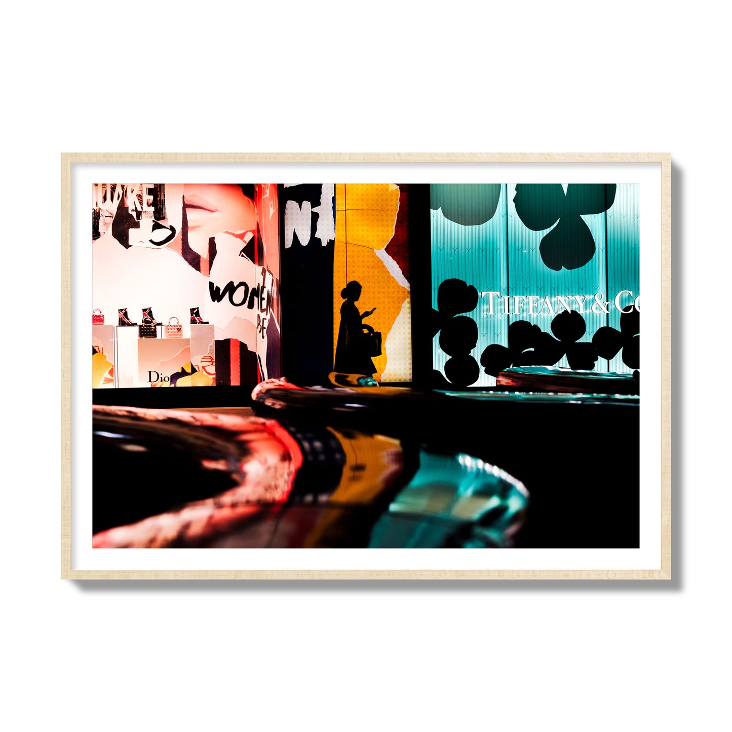 Fine art photograph of a woman’s silhouette walking past vibrant neon store signs, archival pigment print, collector size, natural wood frame.