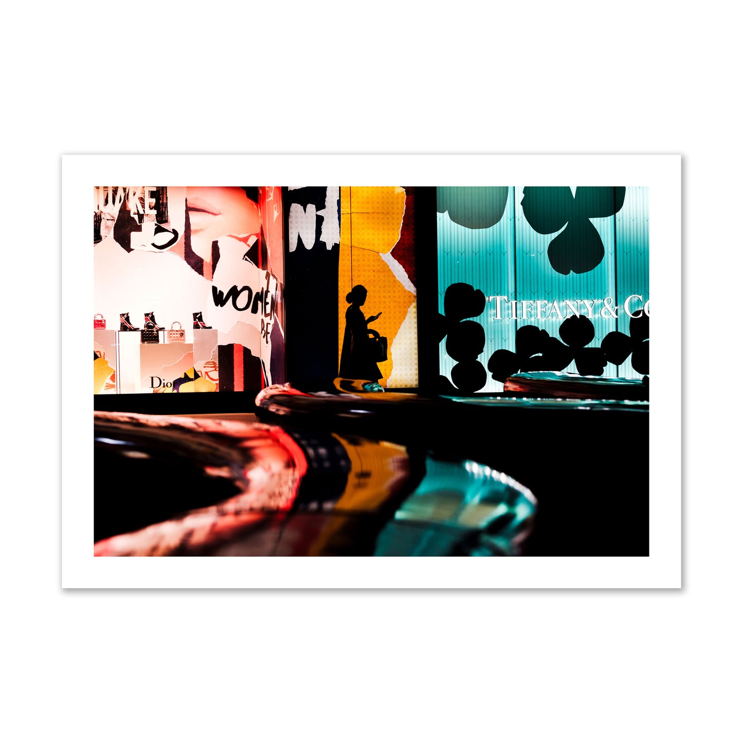 Fine art photograph of a woman’s silhouette walking past vibrant neon store signs, archival pigment print, collector size, unframed.