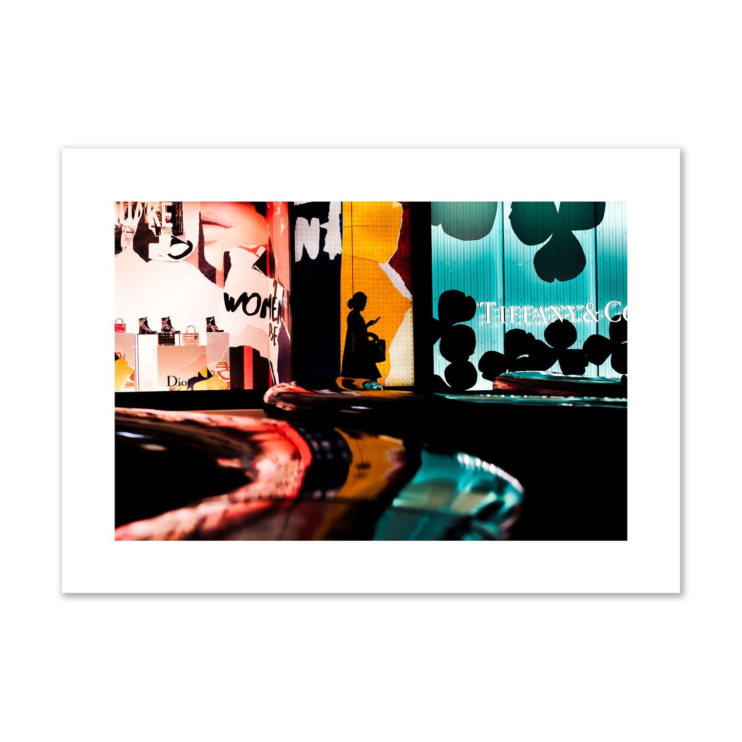 Fine art photograph of a woman’s silhouette walking past vibrant neon store signs, archival pigment print, giant size, unframed.