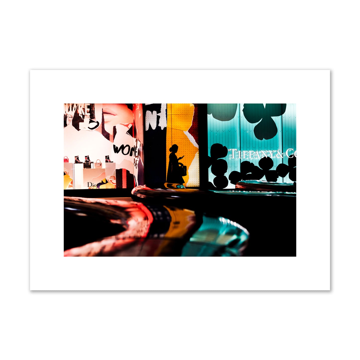Fine art photograph of a woman’s silhouette walking past vibrant neon store signs, archival pigment print, medium size, unframed.