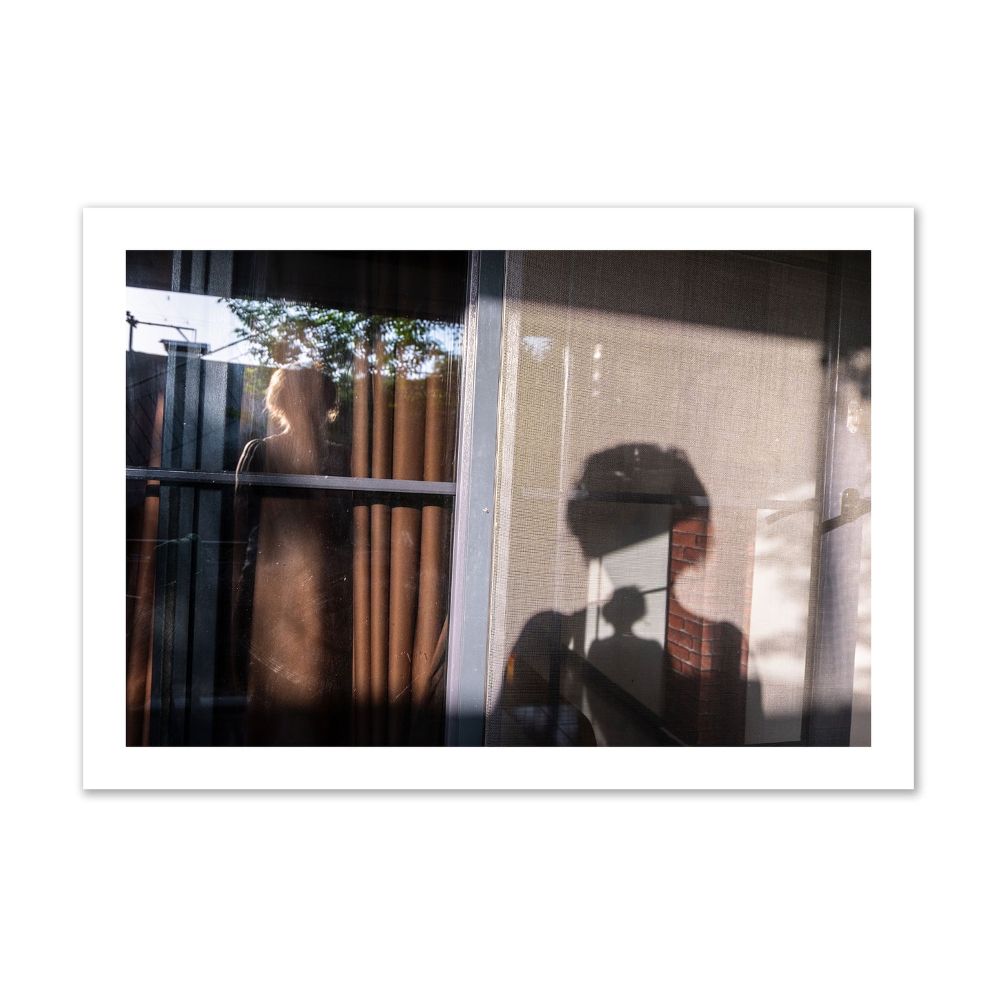 Fine art photograph of a person's silhouette against a window with curtains, archival pigment print, collector size, unframed.