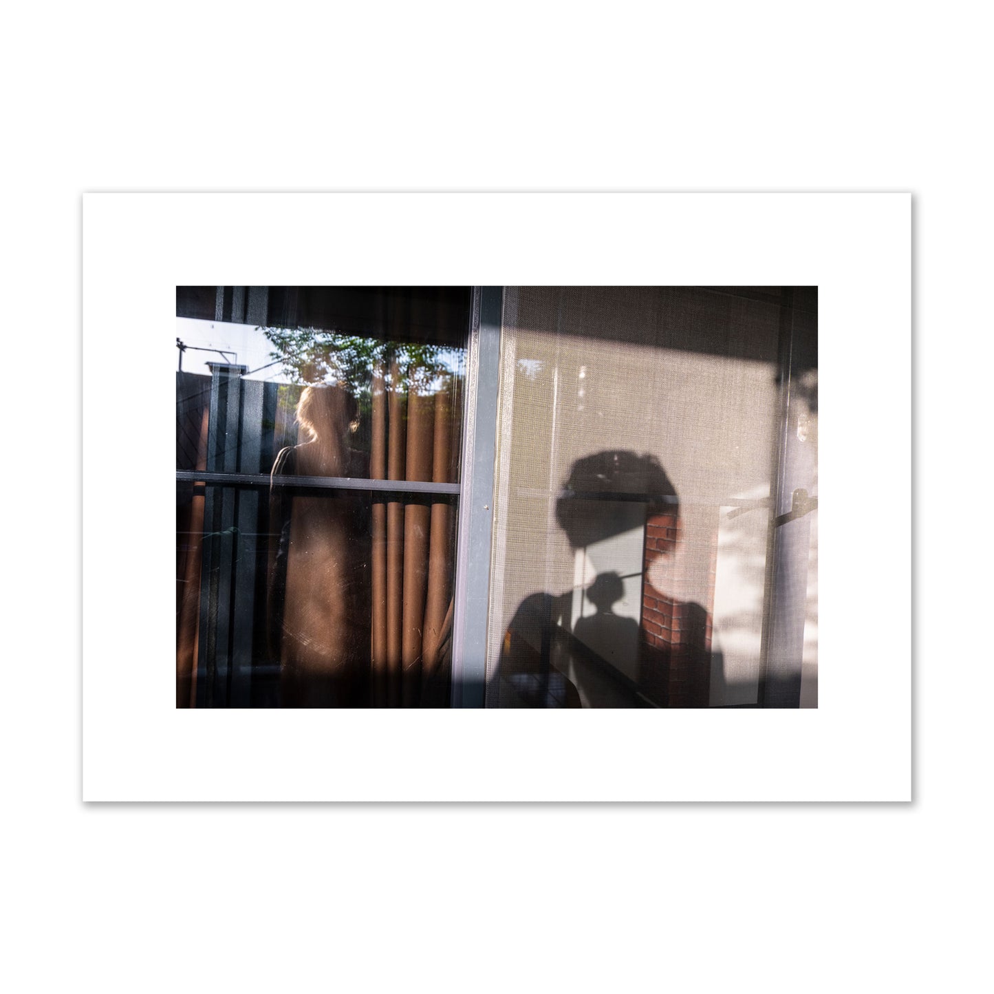 Fine art photograph of a person's silhouette against a window with curtains, archival pigment print, medium size, unframed.