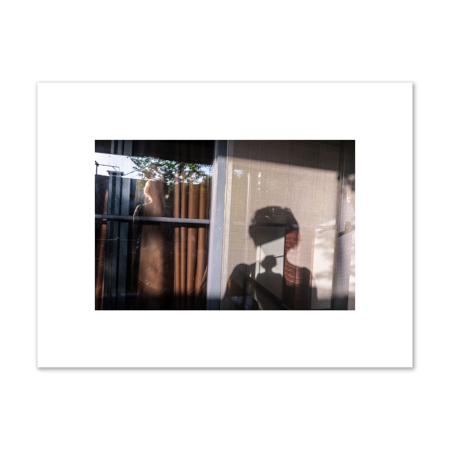 Fine art photograph of a person's silhouette against a window with curtains, archival pigment print, small size, unframed.