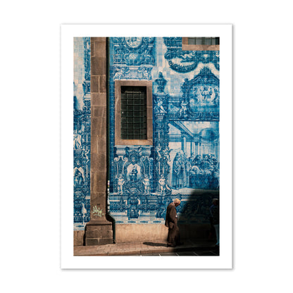Fine art street photograph of an elderly man walking past traditional blue azulejo tile mural on a historic building in Lisbon, Portugal, archival pigment print, collector size, print.