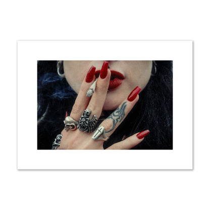 Fine art close-up photograph of a woman smoking, her hands covered with chunky rings and tattoos. Archival pigment print, medium size, print.