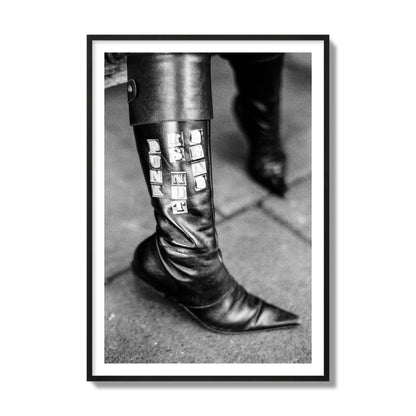 Fine art black and white photo of a woman's black leather boot with the words Punk is Not Dead, archival pigment print, collector size, black frame.