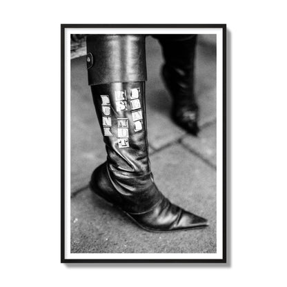 Fine art black and white photo of a woman's black leather boot with the words Punk is Not Dead, archival pigment print, gallery size, black frame.