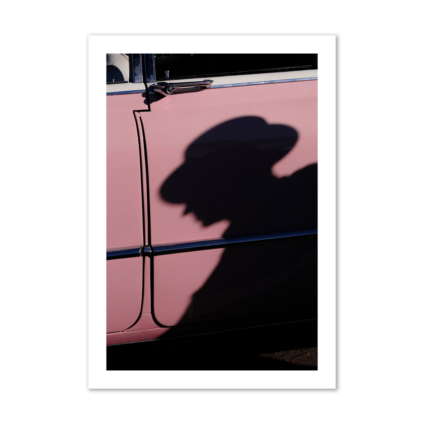 Fine art photograph of a man's shadow cast on a pink retro car, archival pigment print, collector size, print.