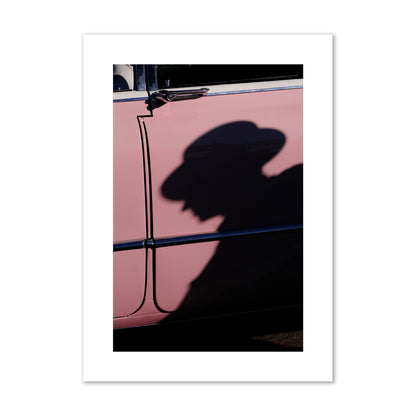 Fine art photograph of a man's shadow cast on a pink retro car, archival pigment print, giant size, print.