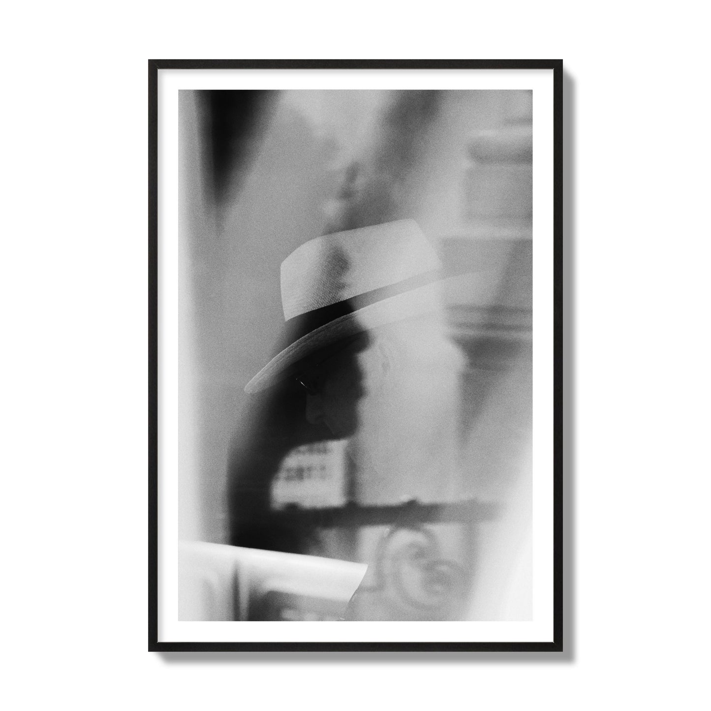 Fine art black and white photograph of multiple faces reflecting in a window, archival pigment print, collector size, black frame.