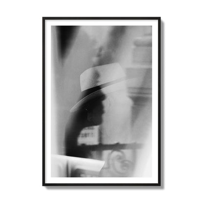 Fine art black and white photograph of multiple faces reflecting in a window, archival pigment print, collector size, black frame.
