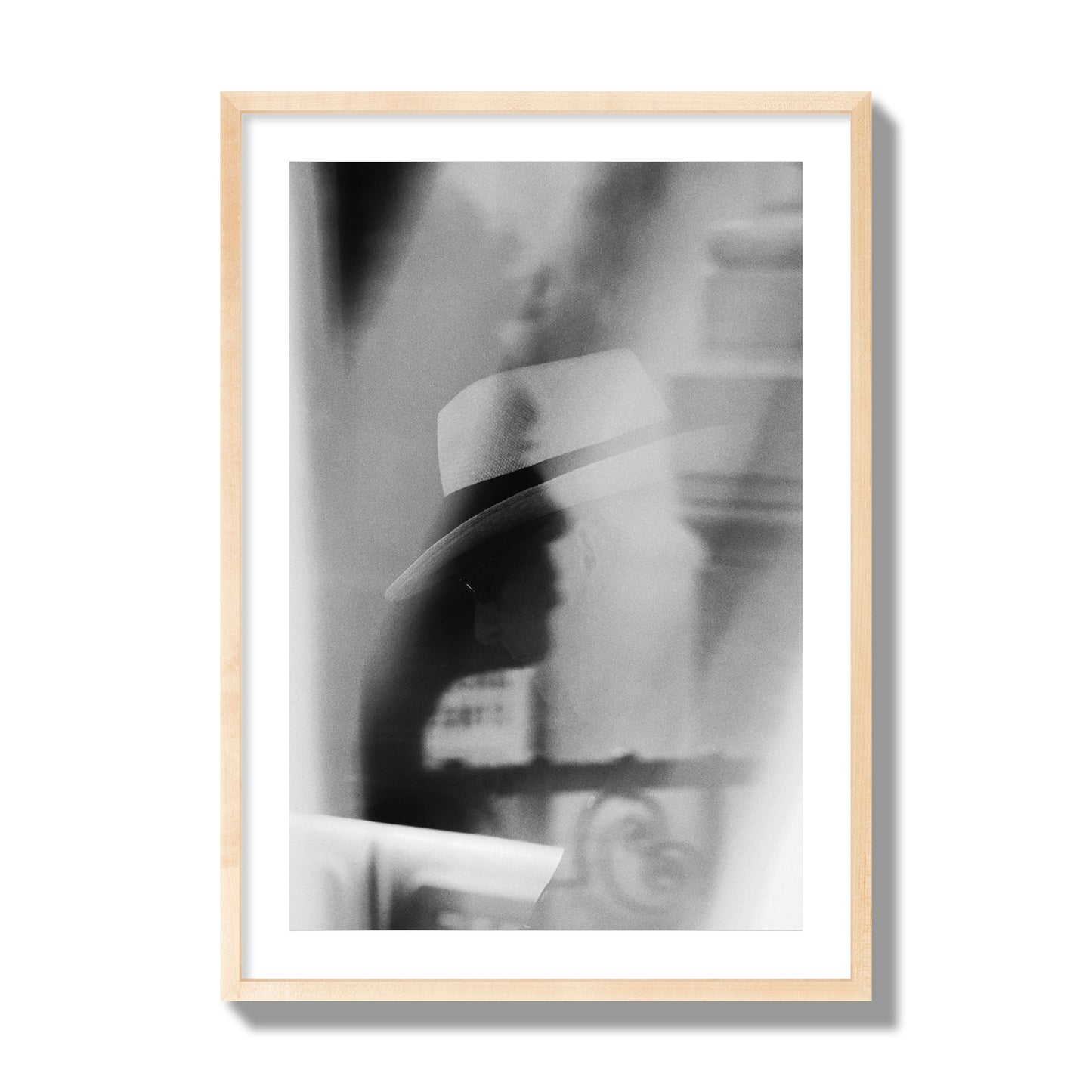 Fine art black and white photograph of multiple faces reflecting in a window, archival pigment print, giant size, natural wood frame.
