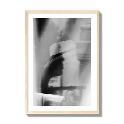 Fine art black and white photograph of multiple faces reflecting in a window, archival pigment print, giant size, natural wood frame.
