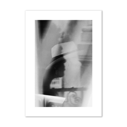 Fine art black and white photograph of multiple faces reflecting in a window, archival pigment print, large size, print.