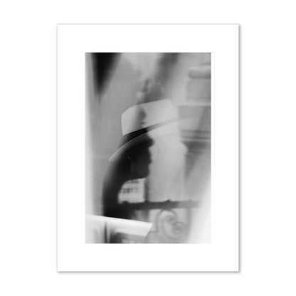 Fine art black and white photograph of multiple faces reflecting in a window, archival pigment print, medium size, print.