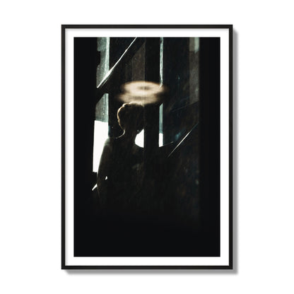 Fine art photograph of a silhouetted woman with a glowing halo light above her head, archival pigment print, collector size, black frame.