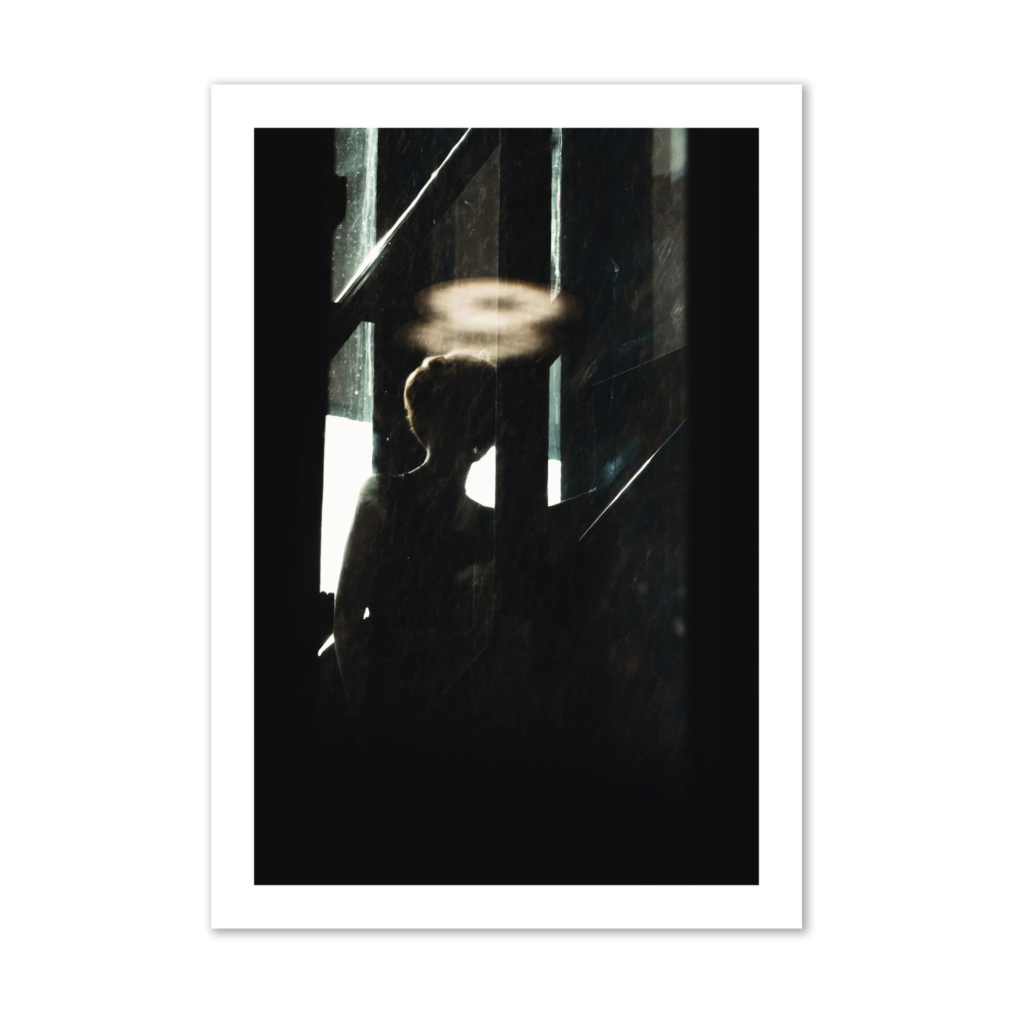 Fine art photograph of a silhouetted woman with a glowing halo light above her head, archival pigment print, collector size, print.