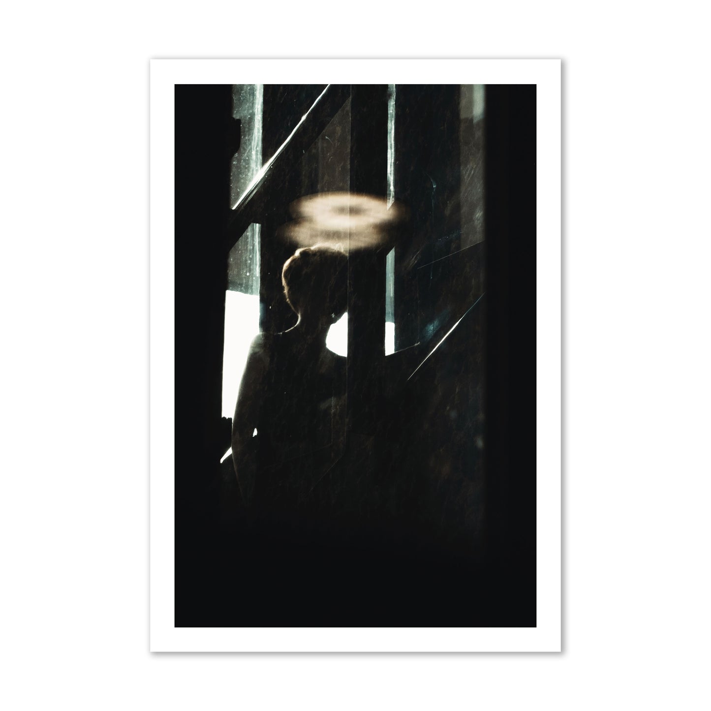 Fine art photograph of a silhouetted woman with a glowing halo light above her head, archival pigment print, gallery size, print.