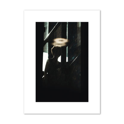 Fine art photograph of a silhouetted woman with a glowing halo light above her head, archival pigment print, medium size, print.
