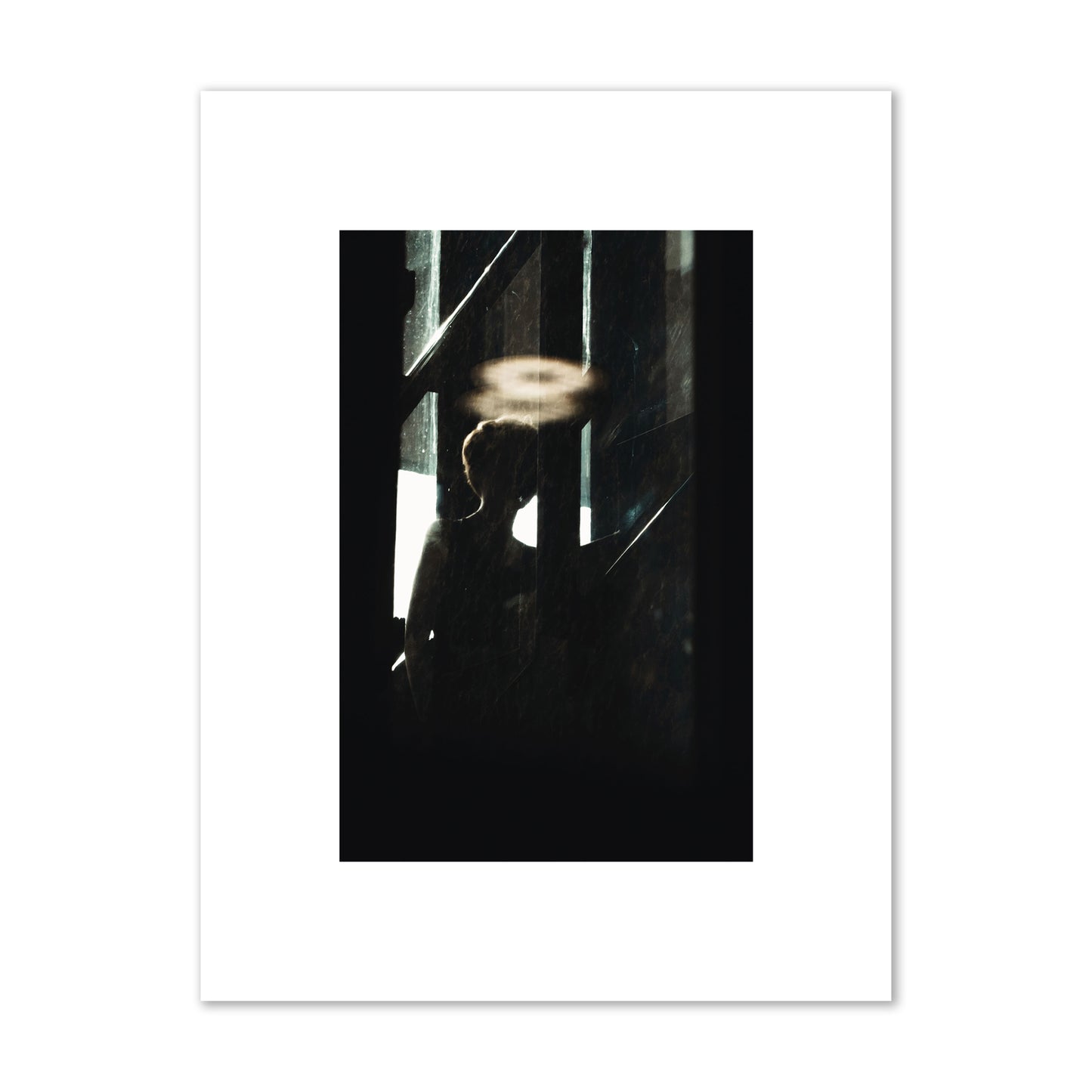 Fine art photograph of a silhouetted woman with a glowing halo light above her head, archival pigment print, small size, print.