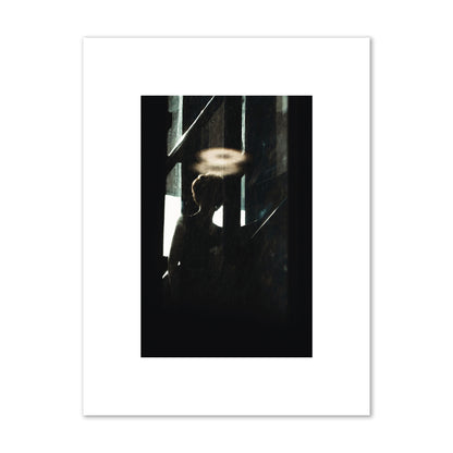 Fine art photograph of a silhouetted woman with a glowing halo light above her head, archival pigment print, small size, print.