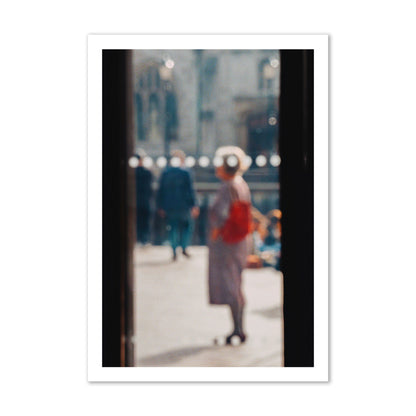 Fine art photograph of a blurred street scene with people and a storefront, archival pigment print, gallery size, print.