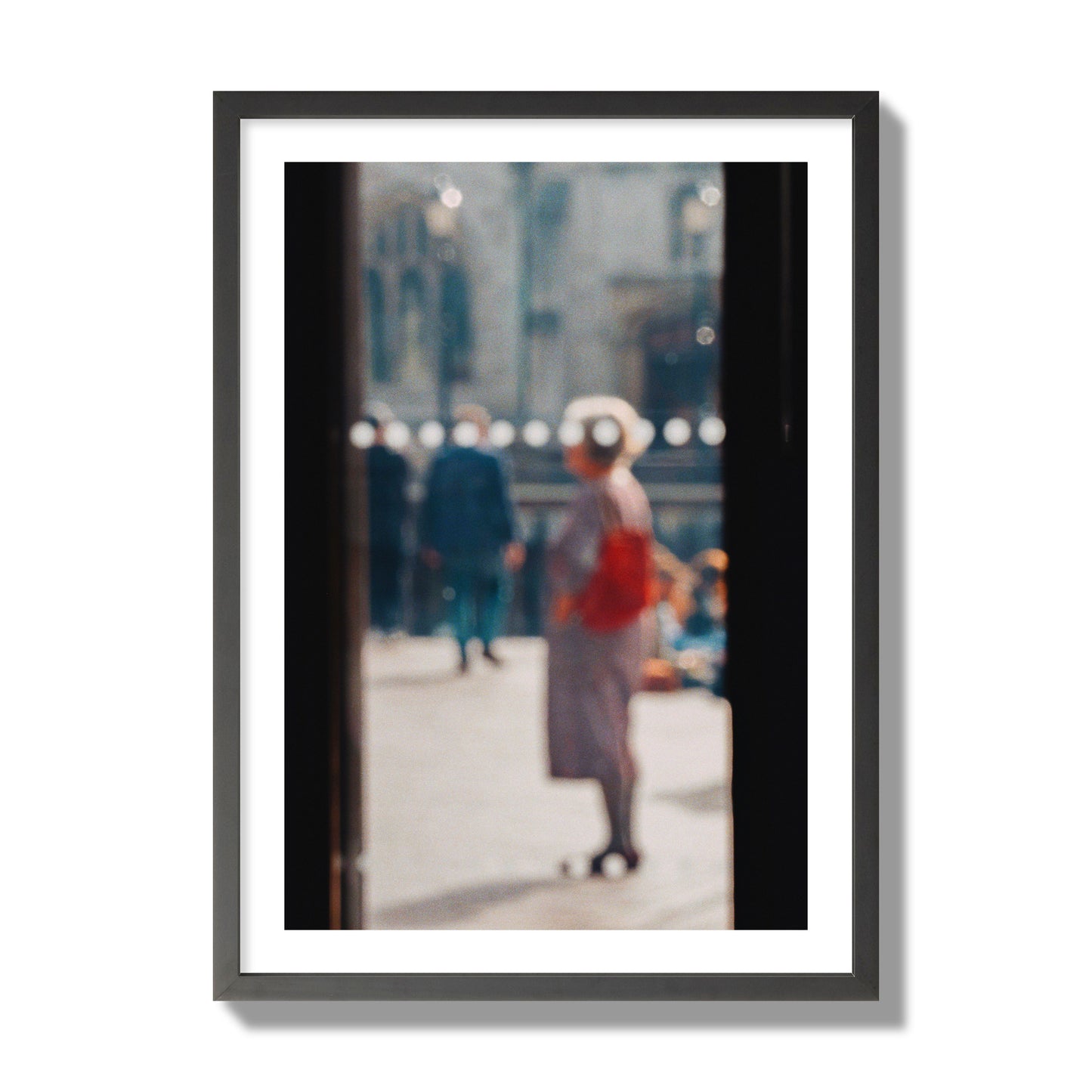 Fine art photograph of a blurred street scene with people and a storefront, archival pigment print, giant size, black frame.