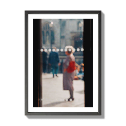 Fine art photograph of a blurred street scene with people and a storefront, archival pigment print, giant size, black frame.