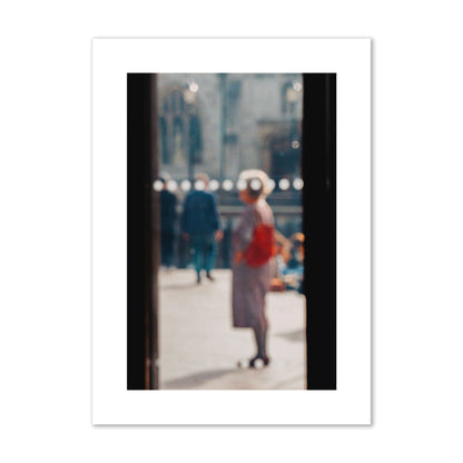 Fine art photograph of a blurred street scene with people and a storefront, archival pigment print, large size, print.