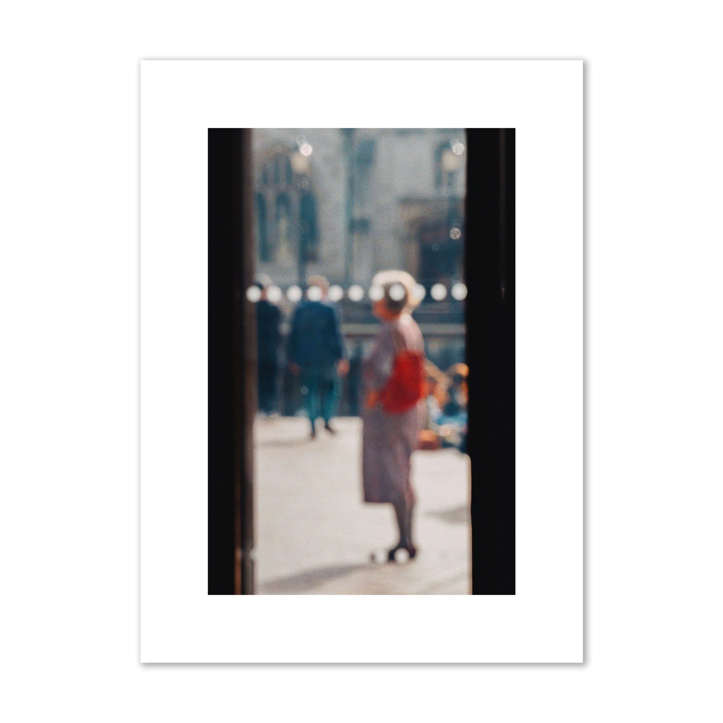 Fine art photograph of a blurred street scene with people and a storefront, archival pigment print, medium size, print.
