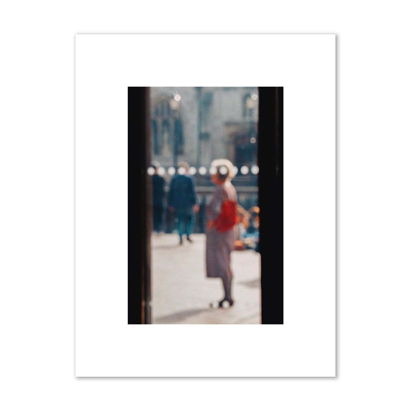 Fine art photograph of a blurred street scene with people and a storefront, archival pigment print, small size, print.