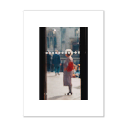 Fine art photograph of a blurred street scene with people and a storefront, archival pigment print, small size, print.