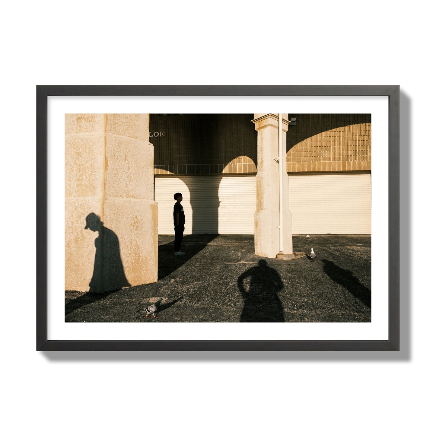 Fine art street photograph of shadows cast on the walls of the Indiana Tea House at Cottesloe Perth Western Australia. Archival pigment print, giant size, black frame.
