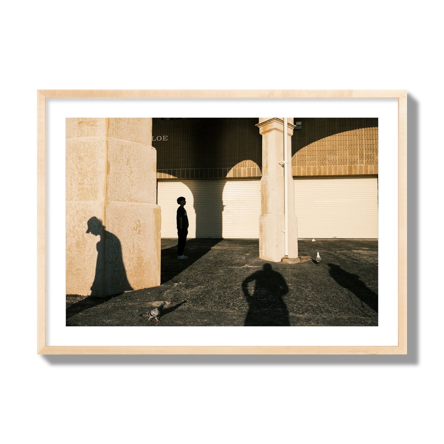 Fine art street photograph of shadows cast on the walls of the Indiana Tea House at Cottesloe Perth Western Australia. Archival pigment print, giant size, natural wood frame.