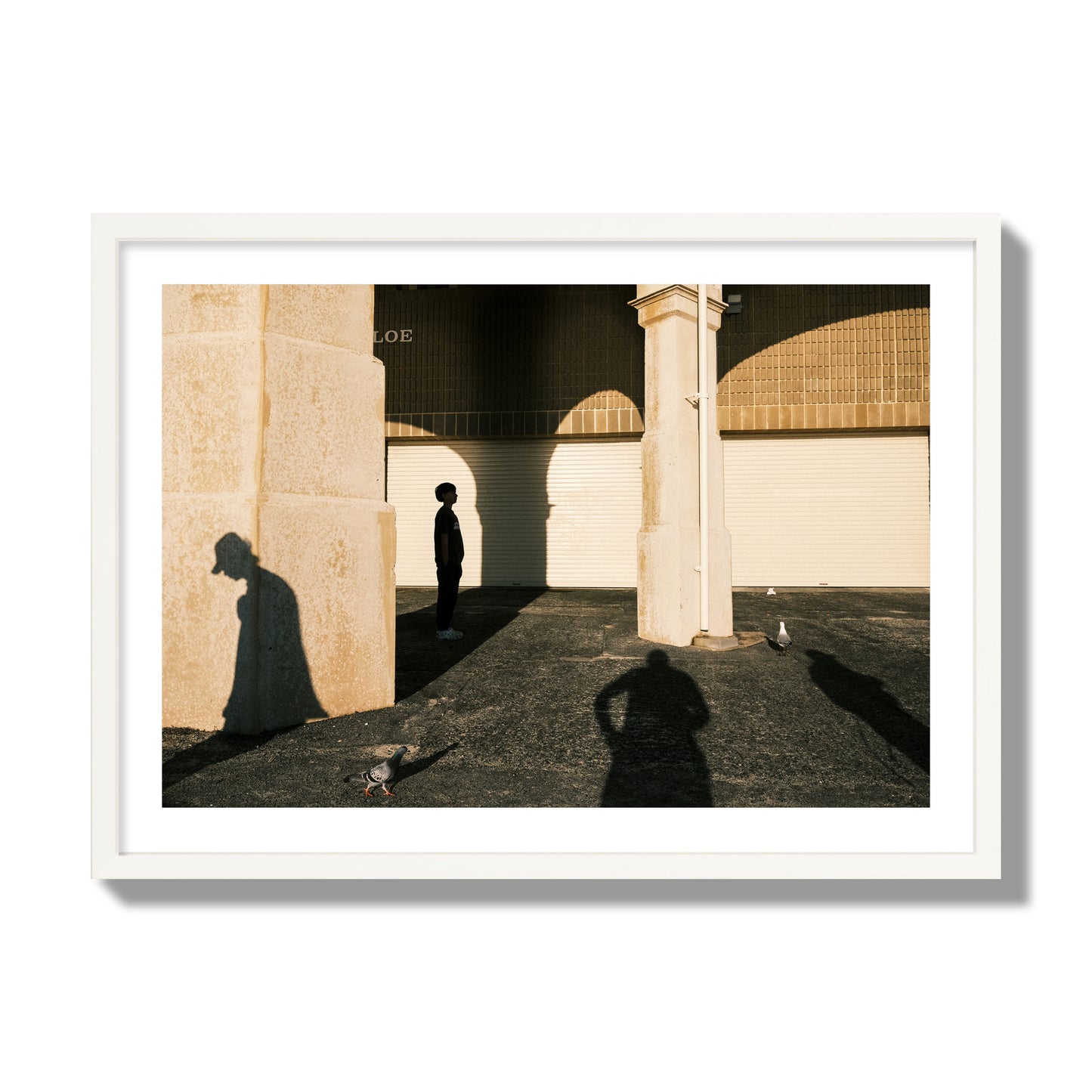 Fine art street photograph of shadows cast on the walls of the Indiana Tea House at Cottesloe Perth Western Australia. Archival pigment print, giant size, white frame.