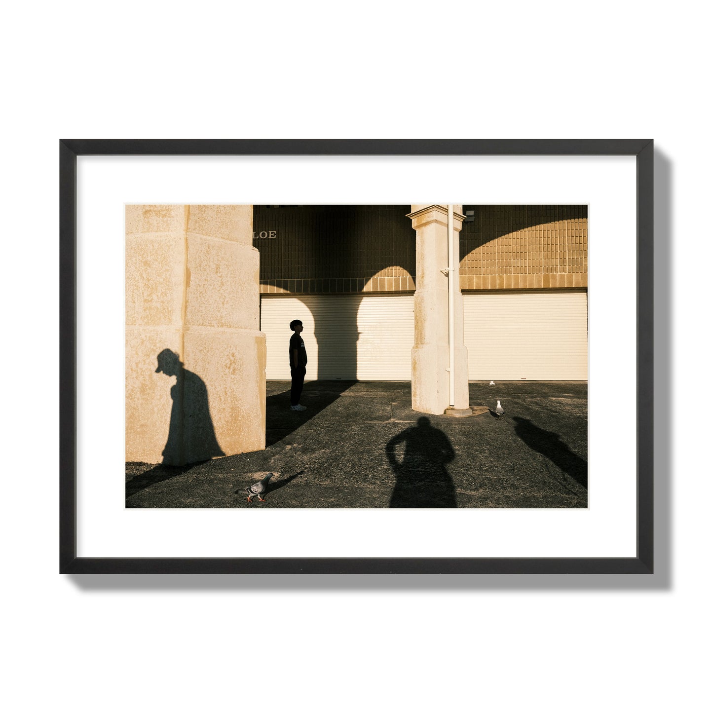 Fine art street photograph of shadows cast on the walls of the Indiana Tea House at Cottesloe Perth Western Australia. Archival pigment print, large size, black frame.