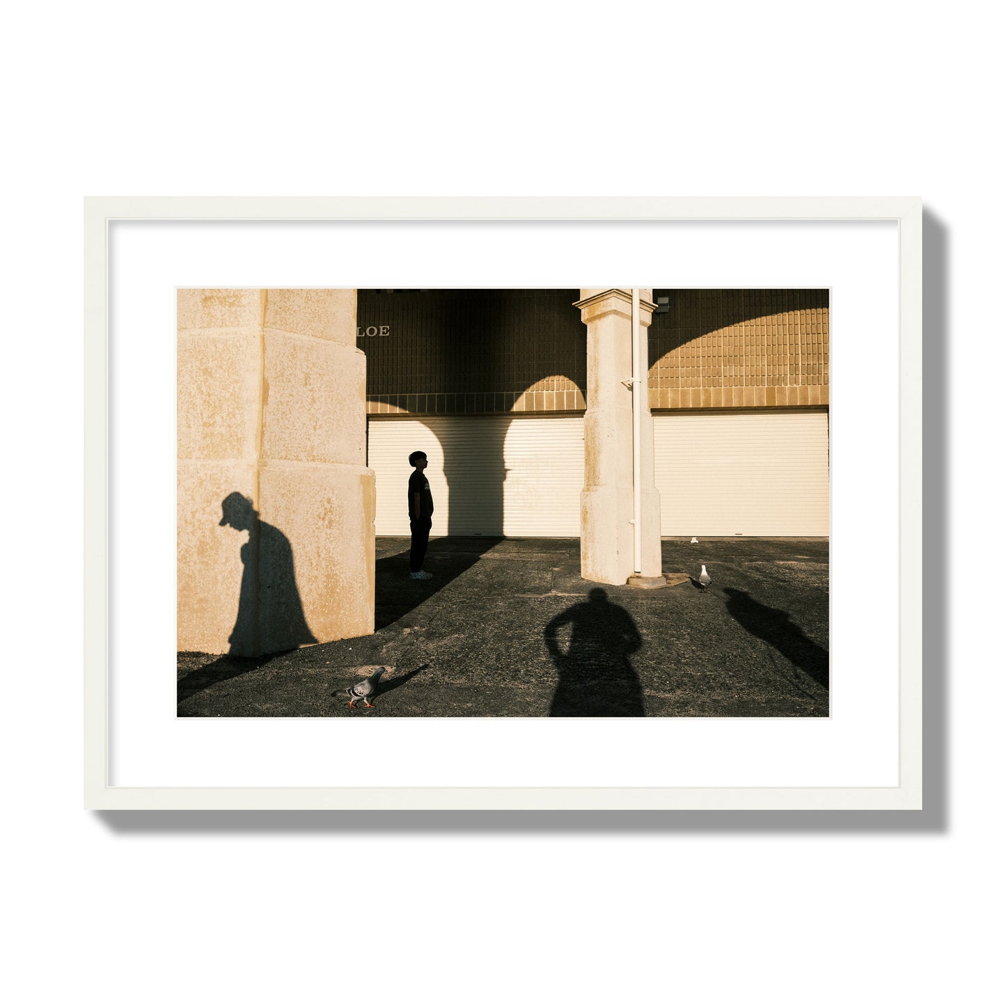 Fine art street photograph of shadows cast on the walls of the Indiana Tea House at Cottesloe Perth Western Australia. Archival pigment print, large size, white frame.