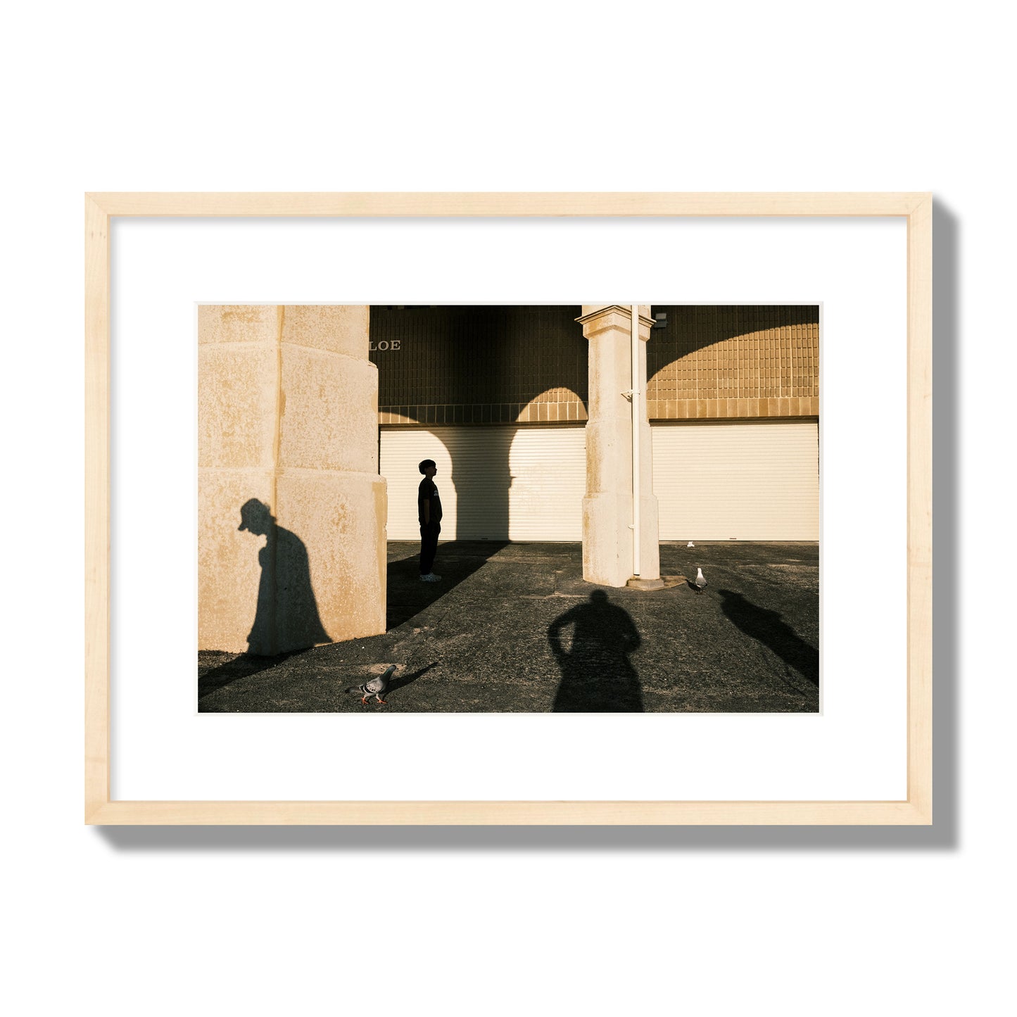 Fine art street photograph of shadows cast on the walls of the Indiana Tea House at Cottesloe Perth Western Australia. Archival pigment print, medium size, natural wood frame.